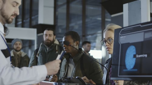 Airport Security Personnel Processing Passengers