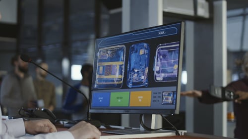 Employee Exploring Baggage Through X-ray