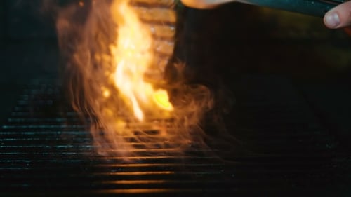 Turn Meat on Grill. Shot of Cooking Steak on Grill.