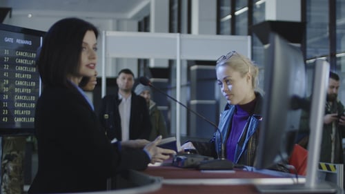 Airport Security Personnel Processing Passengers