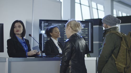 Airport Security Personnel Processing Passengers