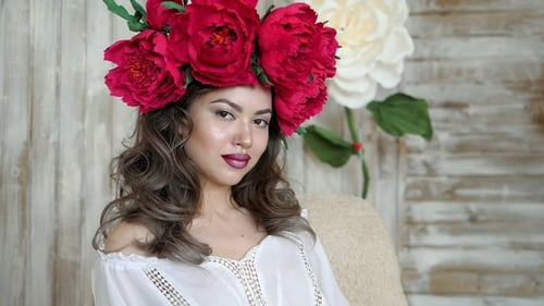 Beautiful Woman with Flower Crown in Studio Portrait