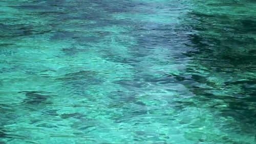 Gentle Turquoise Water Ripples on Tropical Ocean Surface