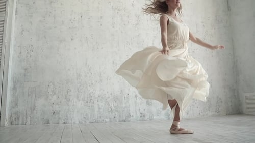 Graceful Woman Dances Ballet in Bright Studio