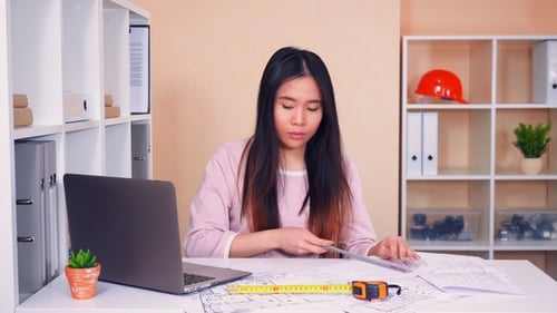 Designer Works with Drawing