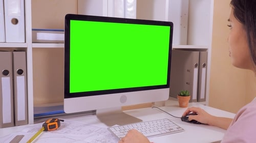 Woman Works at Computer With Green Screen