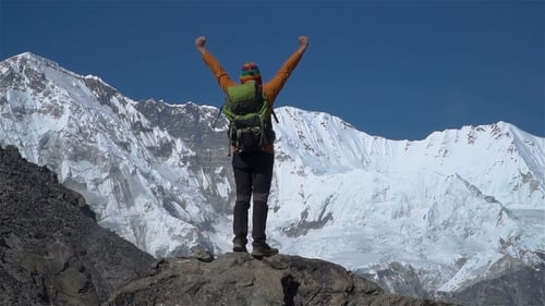The Tourist Climbs the Cliff in the Himalayas