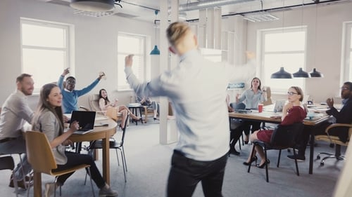 Camera Follows Happy Businessman Walk Into Office, Doing Funny Celebration Dance. Multi-ethnic