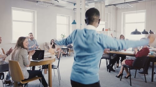 Camera Follows African American Man Enter Office Doing Joyful Dance of Success, High-fiving Multi