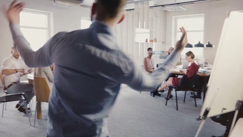 Camera Follows Young Man Enter Office with Crazy Victory Dance, Celebrate Success. Multi-ethnic