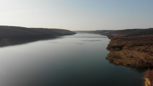 Aerial View From Drone. Flying Over the Beautiful Lake or River Near Mountains. Amazing Landscape