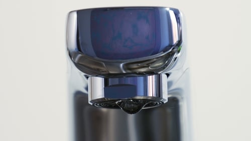 Water Drops Dripping From Chrome Faucet Close Up