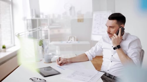Businessman with Papers and Smartphone at Office 15