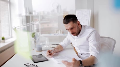 Businessman with Tablet Pc and Papers at Office 8