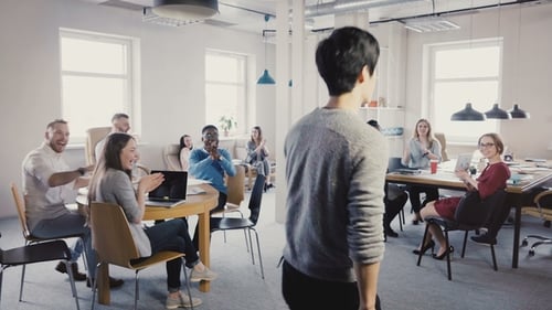Camera Follows Happy Asian Man Doing Funny Victory Celebration Dance Walk in Office, Colleagues Clap