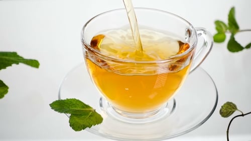 Mint Tea with Leaves Directly Above, White Background