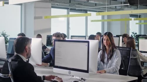 Modern Open Space Office Businessmen and Businesswomen Working in Room with Large Window and View to