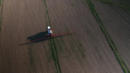 Farm Vehicle Spraying Fields on an Arable Farm with Glyphosate Herbicide