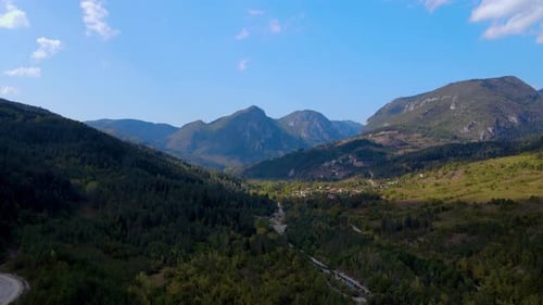 steep green mountains, deep forest and mountain road, beautiful valley
