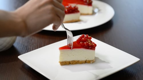 Cutting Into Red Currant Cheesecake Dessert
