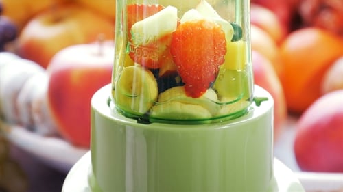 Fruits being blended to make a healthy smoothie