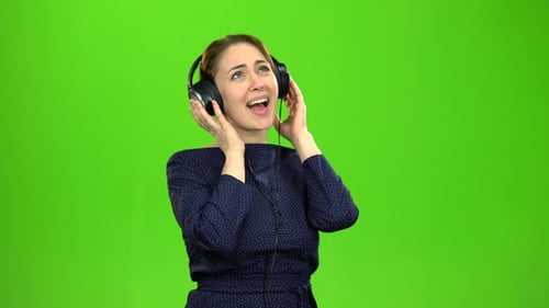 Woman with Headphones Listening to Music
