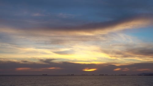 Ocean View Under Dramatic Sunset Sky