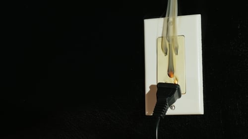 A Thick Black Smoke Flows From a Double American-type Outlet. Fire in the House, the Danger of Life