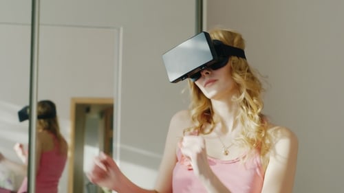 Woman Using Virtual Reality Headset Indoors
