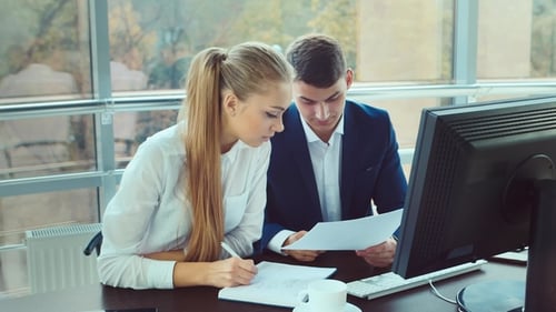 Young Professionals Work Together. Two Young Men Working in the Office