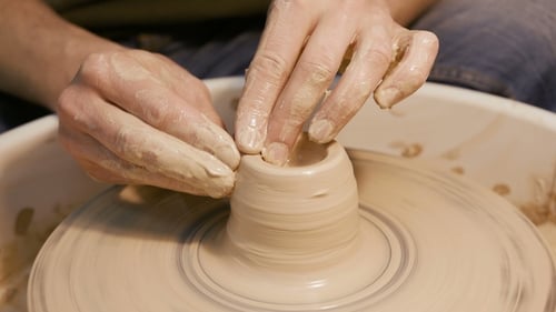 Man Works with a Potter's Wheel, Only Hands