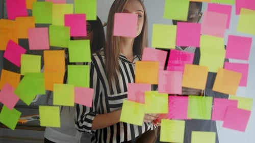 Team Brainstorming Session with Sticky Notes