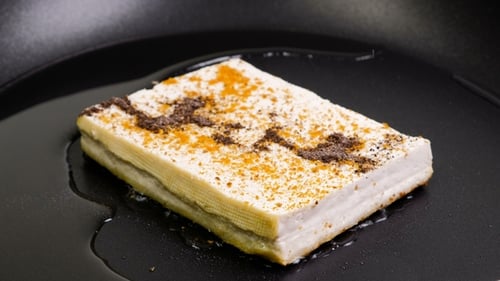 Seasoned Tofu Cooking in a Frying Pan