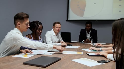 Diverse Team Collaborates at a Corporate Meeting