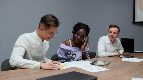 Team Discusses Business Charts in Meeting
