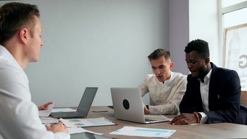 Modern Office Workers Sitting at a Laptop Solve Creative Tasks To Create New Business Products