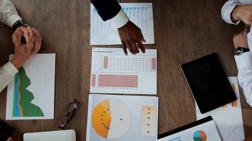 Top View of the Large Desk Behind Which the Office Team of Creative Managers of Different