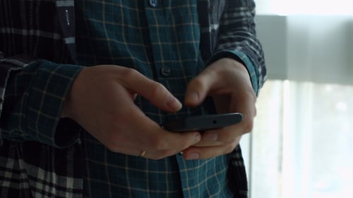 Female Hands Texting Message on Mobile Phone