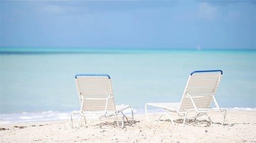 Two Lounge Chairs on Beautiful Tropical Beach at Maldives