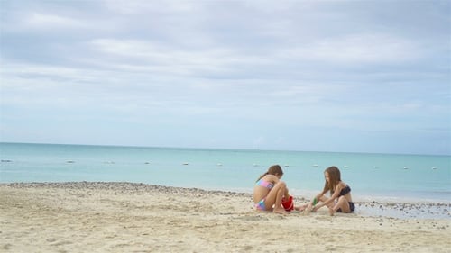 Kids Have a Lot of Fun at Tropical Beach Playing Together