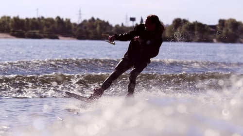 Wake Boarding Rider Enjoy Training. Surfer Making Trick on Wakeboard