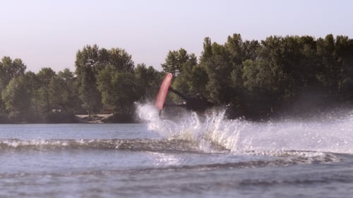 Wakeboarder Making Stunt on Water