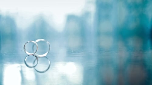 Wedding Rings Reflecting on Smooth Surface