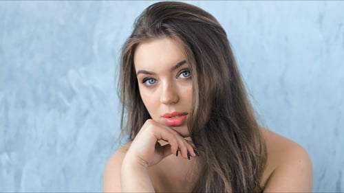 Fashion Model with Professional Beauty Make-up Posing in Studio