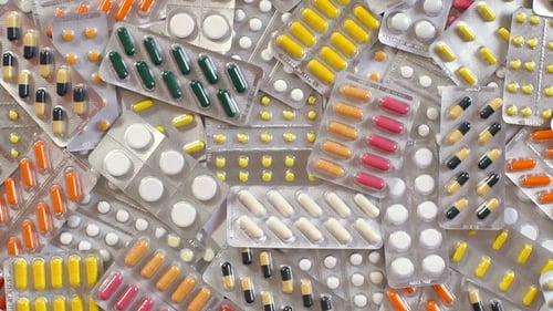Pile of Colorful Pills and Capsules in Blister Packs