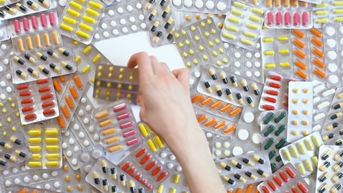 Pills and tablet closeup. Medicinal drugs. Medication capsule color background. Medicament vitamin.