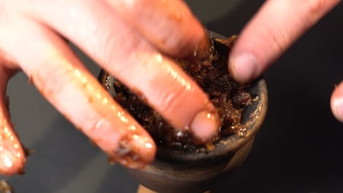 Preparing Hookah Bowl with Chopped Shisha Tobacco