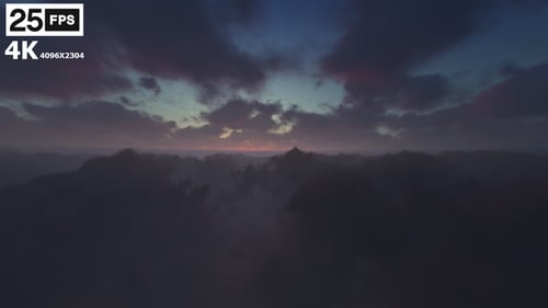 Flying Above Moving Clouds at Sunset Loop