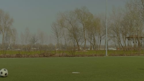 Soccer Striker Shooting on Goal During Training