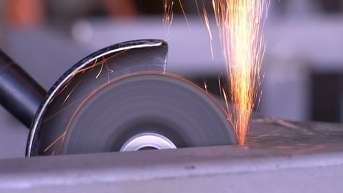 Metal Saw Sparks During Industrial Cutting Process
